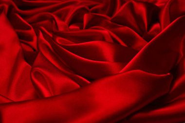 Zengin ve lüks kırmızı ipek kumaş dokusu. Üst görünüm.