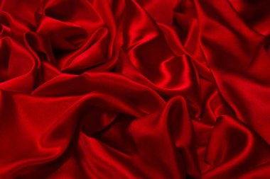 Zengin ve lüks kırmızı ipek kumaş dokusu. Üst görünüm.