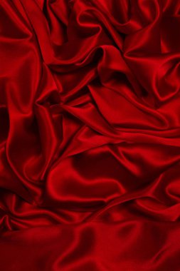 Zengin ve lüks kırmızı ipek kumaş dokusu. Üst görünüm.