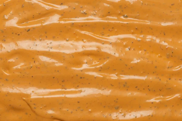 Whipped delicious sauce texture. Hamburger sauce background. Top view.