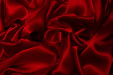 Zengin ve lüks kırmızı ipek kumaş dokusu. Üst görünüm.