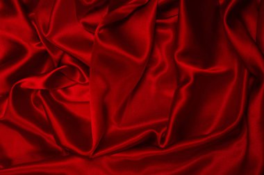 Zengin ve lüks kırmızı ipek kumaş dokusu. Üst görünüm.