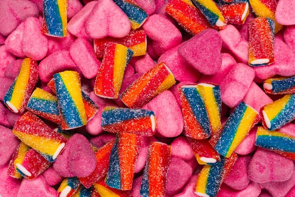 Geassorteerde Smakelijke Gummisnoepjes Bovenaanzicht Roze Gelei Snoepjes Achtergrond — Stockfoto