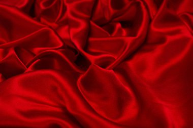 Zengin ve lüks kırmızı ipek kumaş dokusu. Üst görünüm.