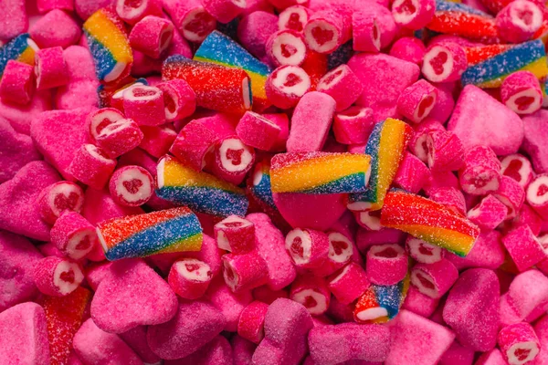 对美味的糖果进行分类 顶部视图 粉红果冻糖果背景 — 图库照片