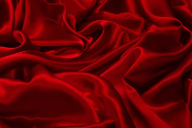 Zengin ve lüks kırmızı ipek kumaş dokusu. Üst görünüm.