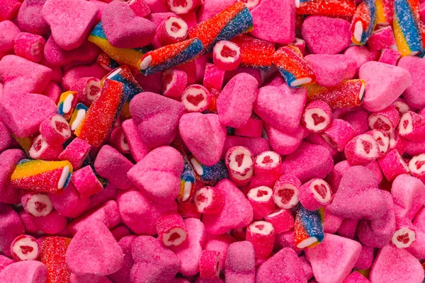 Geassorteerde Smakelijke Gummisnoepjes Bovenaanzicht Roze Gelei Snoepjes Achtergrond — Stockfoto