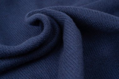 Arka plan olarak lacivert merino yün süveter dokusu. Üst görünüm. 