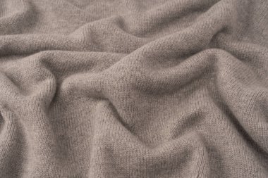 Arka plan olarak yumuşak gri merino yün süveter dokusu. Üst görünüm.