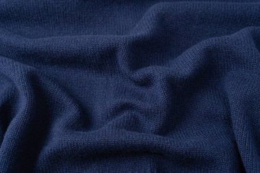 Arka plan olarak lacivert merino yün süveter dokusu. Üst görünüm. 