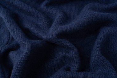 Arka plan olarak lacivert merino yün süveter dokusu. Üst görünüm. 