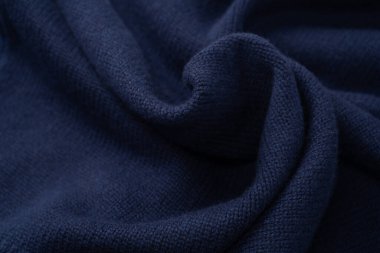 Arka plan olarak lacivert merino yün süveter dokusu. Üst görünüm. 
