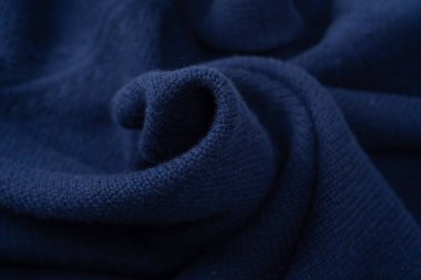 Arka plan olarak lacivert merino yün süveter dokusu. Üst görünüm. 