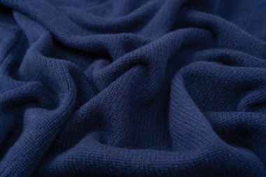 Arka plan olarak lacivert merino yün süveter dokusu. Üst görünüm. 