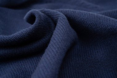 Arka plan olarak lacivert merino yün süveter dokusu. Üst görünüm. 