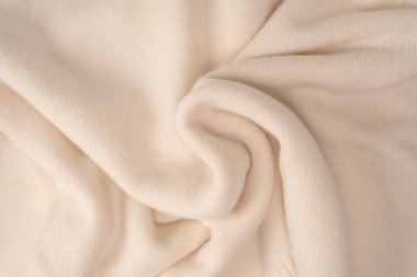 Arka plan olarak yumuşak sütlü merino yün süveter dokusu. Üst görünüm. 
