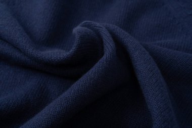 Arka plan olarak lacivert merino yün süveter dokusu. Üst görünüm. 