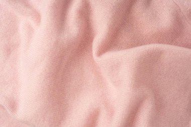 Yumuşak pembe kaşmir süveter desenli arka plan. Üst görünüm. 