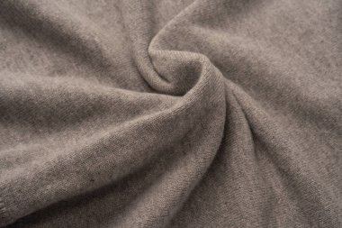 Arka plan olarak yumuşak gri merino yün süveter dokusu. Üst görünüm.