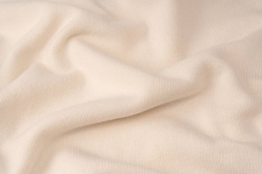 Arka plan olarak yumuşak sütlü merino yün süveter dokusu. Üst görünüm. 