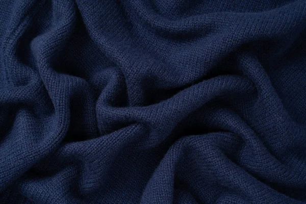 Arka plan olarak lacivert merino yün süveter dokusu. Üst görünüm. 