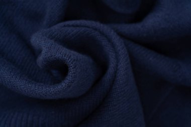 Arka plan olarak lacivert merino yün süveter dokusu. Üst görünüm. 