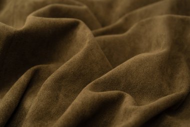 Arka plan olarak yeşil kumaş dokusu. Üst görünüm. 