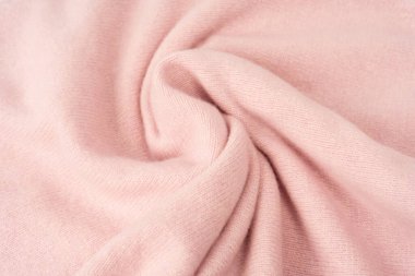 Yumuşak pembe kaşmir süveter desenli arka plan. Üst görünüm. 