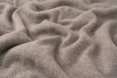 Arka plan olarak yumuşak gri merino yün süveter dokusu. Üst görünüm.