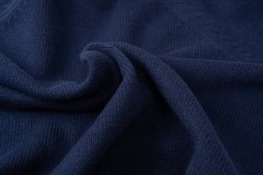 Arka plan olarak lacivert merino yün süveter dokusu. Üst görünüm. 