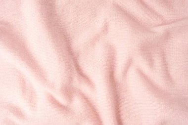 Yumuşak pembe kaşmir süveter desenli arka plan. Üst görünüm. 