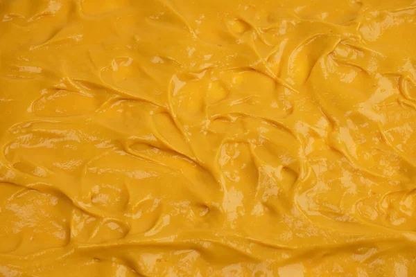 Sarı sos arka plan olarak sıçrıyor. Üst görünüm. 