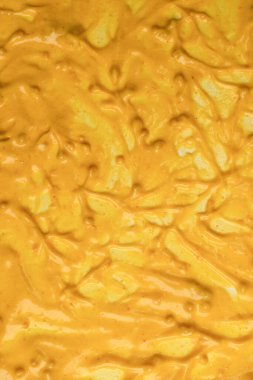 Sarı sos arka plan olarak sıçrıyor. Üst görünüm. 