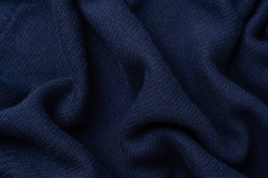 Arka plan olarak lacivert merino yün süveter dokusu. Üst görünüm. 