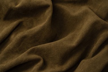 Arka plan olarak yeşil kumaş dokusu. Üst görünüm. 