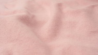 Yumuşak pembe kaşmir süveter desenli arka plan. Üst görünüm. 