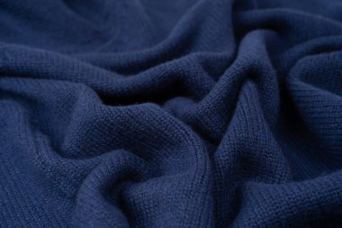 Arka plan olarak lacivert merino yün süveter dokusu. Üst görünüm. 