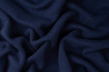 Arka plan olarak lacivert merino yün süveter dokusu. Üst görünüm. 