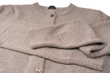 Arka plan olarak gri hırka dokusu. Örgü desenli. Üst görünüm. 