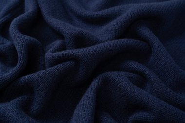 Arka plan olarak lacivert merino yün süveter dokusu. Üst görünüm. 