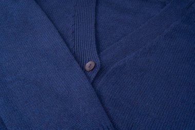 Arka plan olarak lacivert merino yün hırka dokusu. Üst görünüm. 