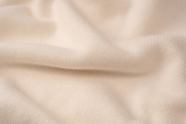 Arka plan olarak yumuşak sütlü merino yün süveter dokusu. Üst görünüm. 