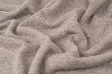 Arka plan olarak yumuşak gri merino yün süveter dokusu. Üst görünüm.