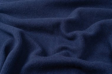 Arka plan olarak lacivert merino yün süveter dokusu. Üst görünüm. 