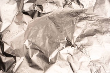 Parlak gümüş folyo arka plan. Üst görünüm.