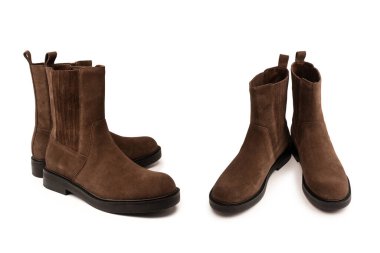 Kahverengi deri çizmeler beyaz arka planda izole edilmiş..