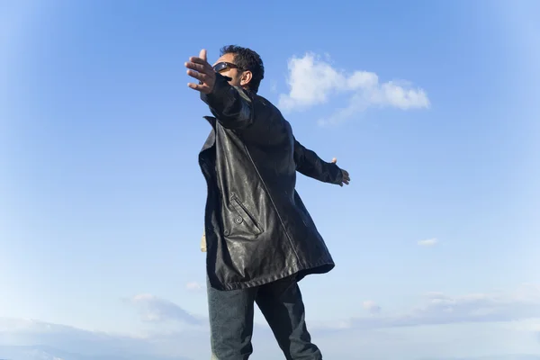 Young man greets the nature — Stock Photo, Image