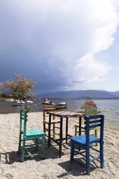 Characteristic restaurant table and chair on coast of the lake — Stock Photo, Image