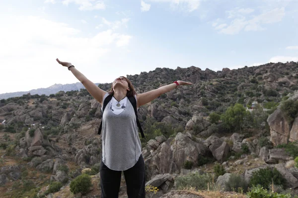 Happy young woman greets the mountain and sea — Stock Photo, Image