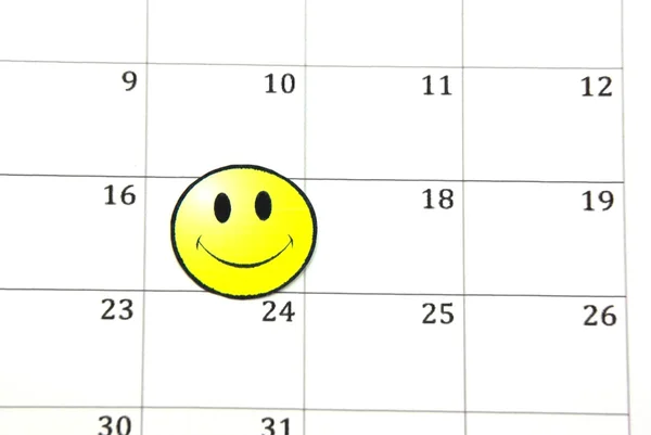 Lächeln Gesicht auf Kalender — Stockfoto